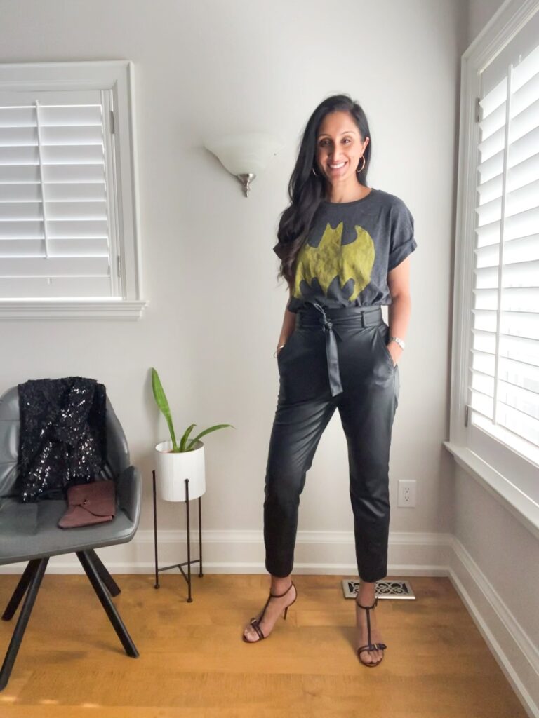 A graphic t-shirt styled with heels and leather pants
